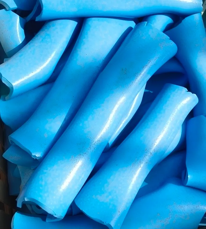 Blue PVC pipe purges in a wooden crate, seen from above