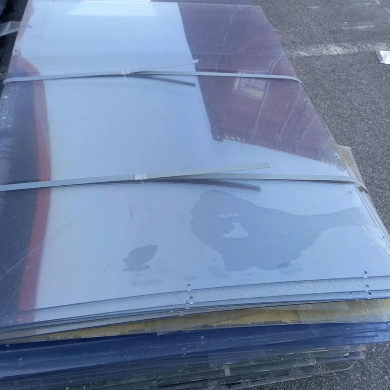 Strapped stack of PVC off-cut sheets on a pallet