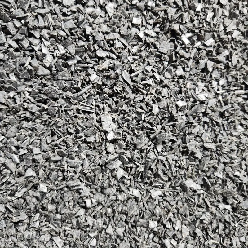 Black PVC window profile regrind, close-up