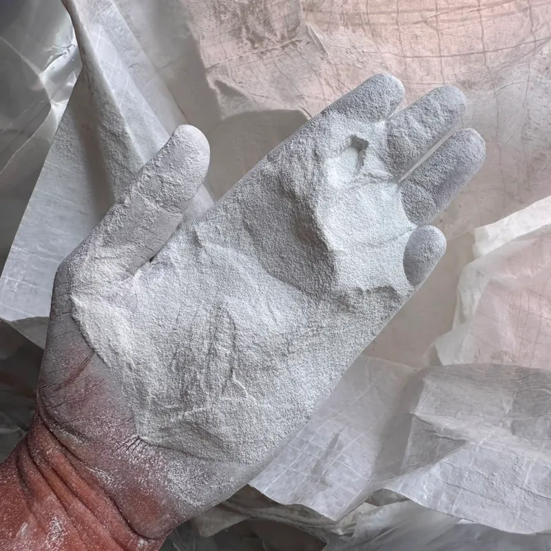 Hand covered in white Westlake off-grade PVC resin powder