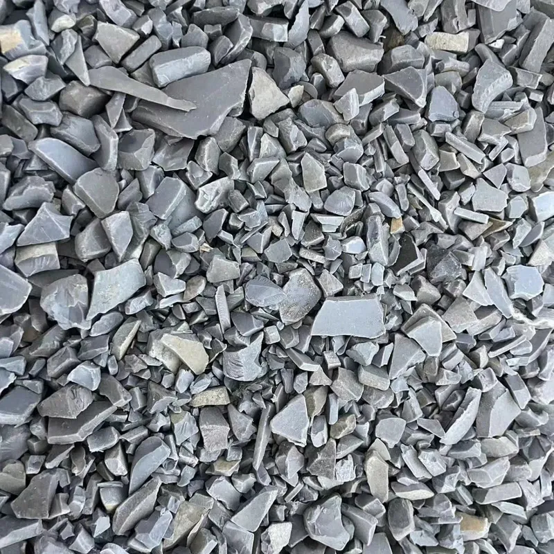 Grey PVC pipe regrind flakes, closer view