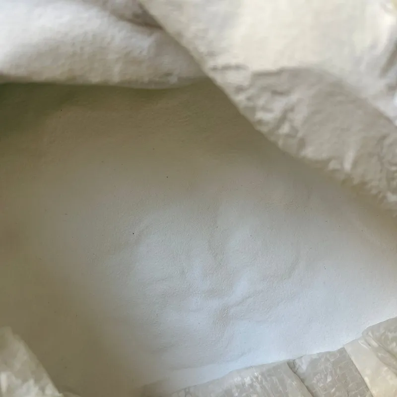 White LG off-grade PVC resin powder in an open bulk bag